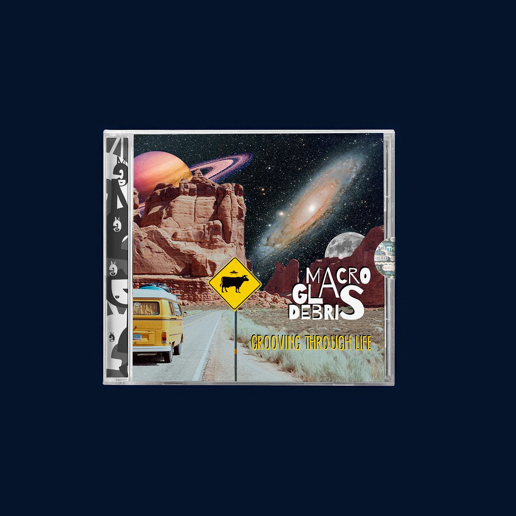 Copertina del cd Grooving Through Life dei Macro Glas Debris: un furgone giallo su una strada del deserto, un cartello con una mucca e pianeti nel cielo